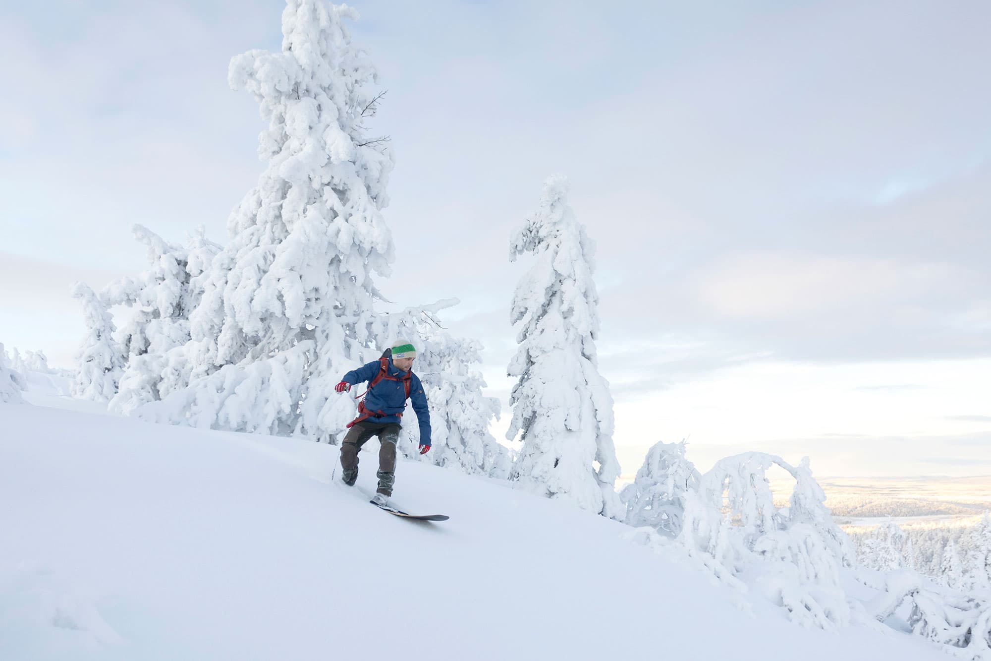 One snow surfer riding a frozen wave in Ylläs-Pallas National Park. Guided by Taneli Roininen, Janne Koivistoinen and Jussa Loueniva.